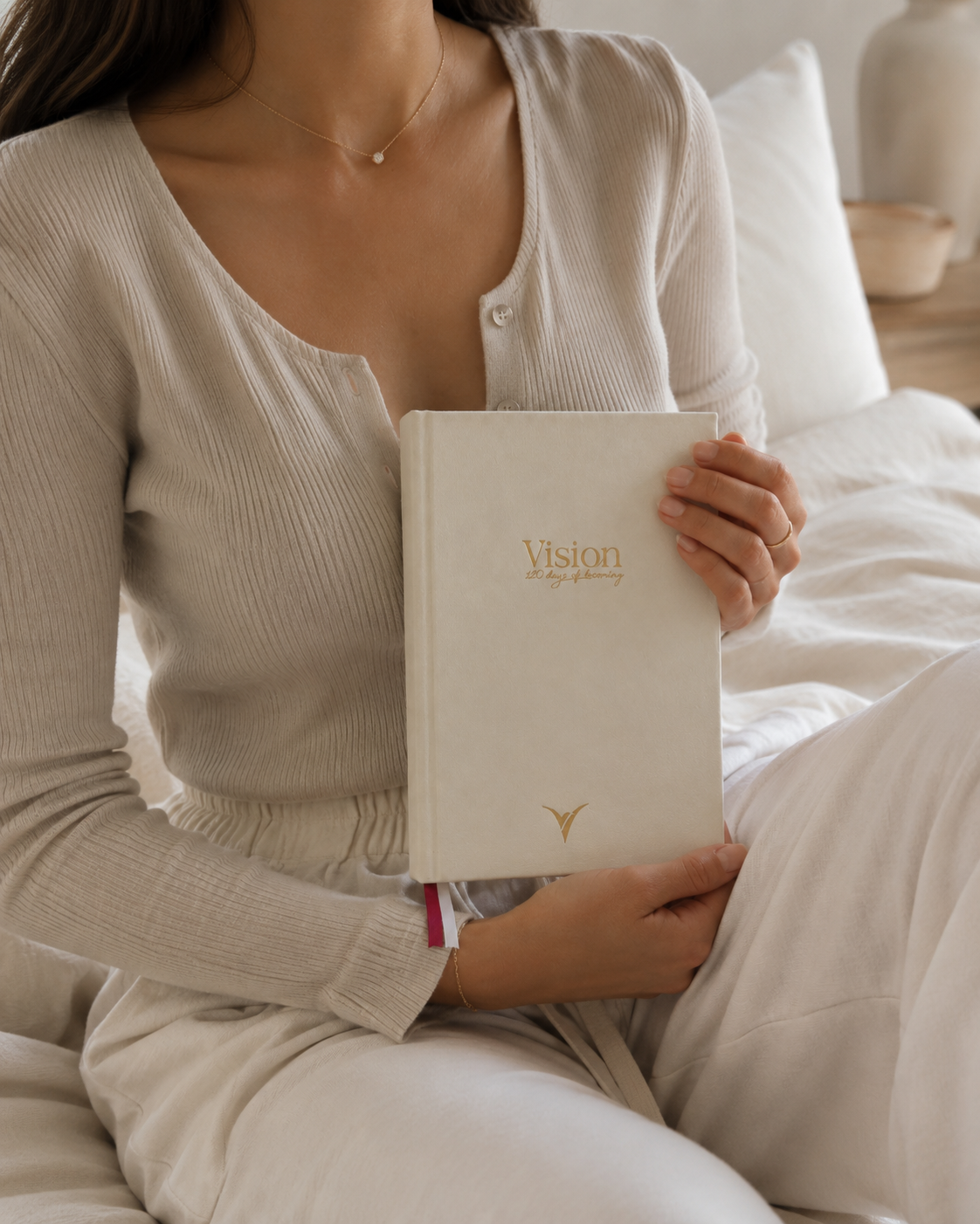 Woman holding the VisionRuya undated daily planner