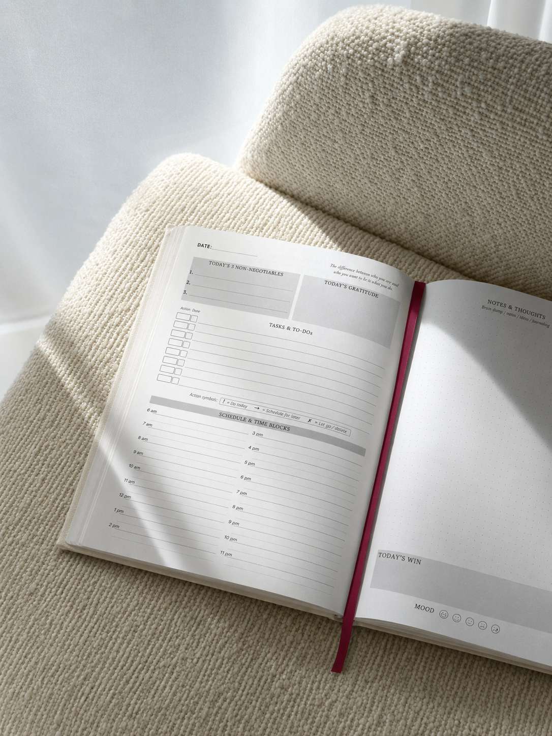 Daily planning spread on a soft chair