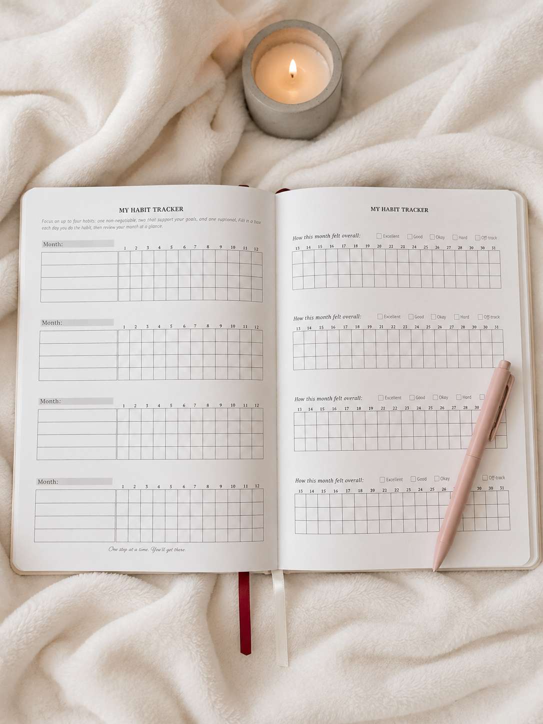 Blank habit tracker spread with a pink pen