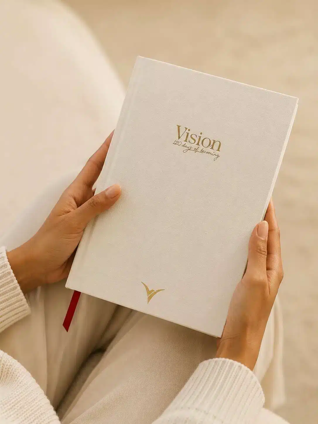 Holding the VisionRuya undated daily planner, 120 Days of Becoming