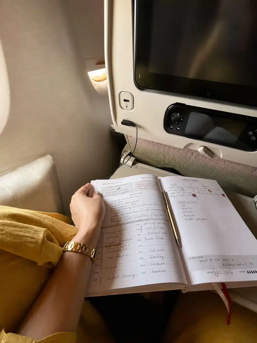 Journaling in the 120 Days of Becoming planner while traveling