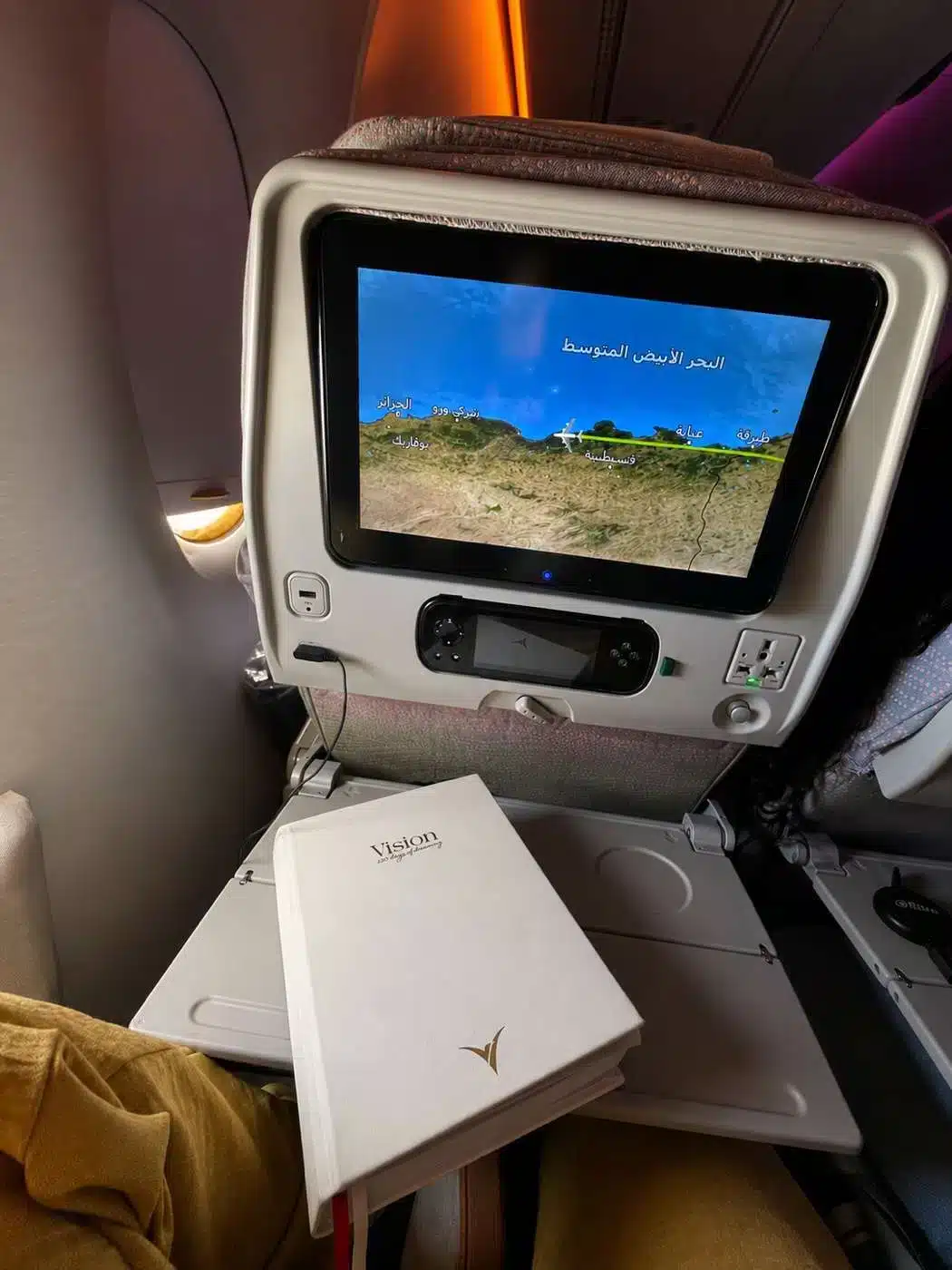 Vision planner on an airplane tray table during a flight